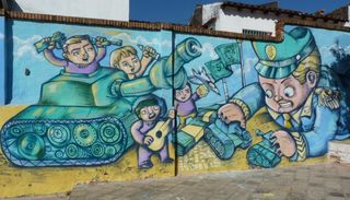 Mural colectivo sobre desmilitarización y cultura de paz